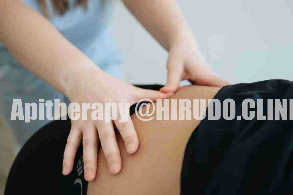 Close-up of a therapist providing back massage therapy in Vilnius.